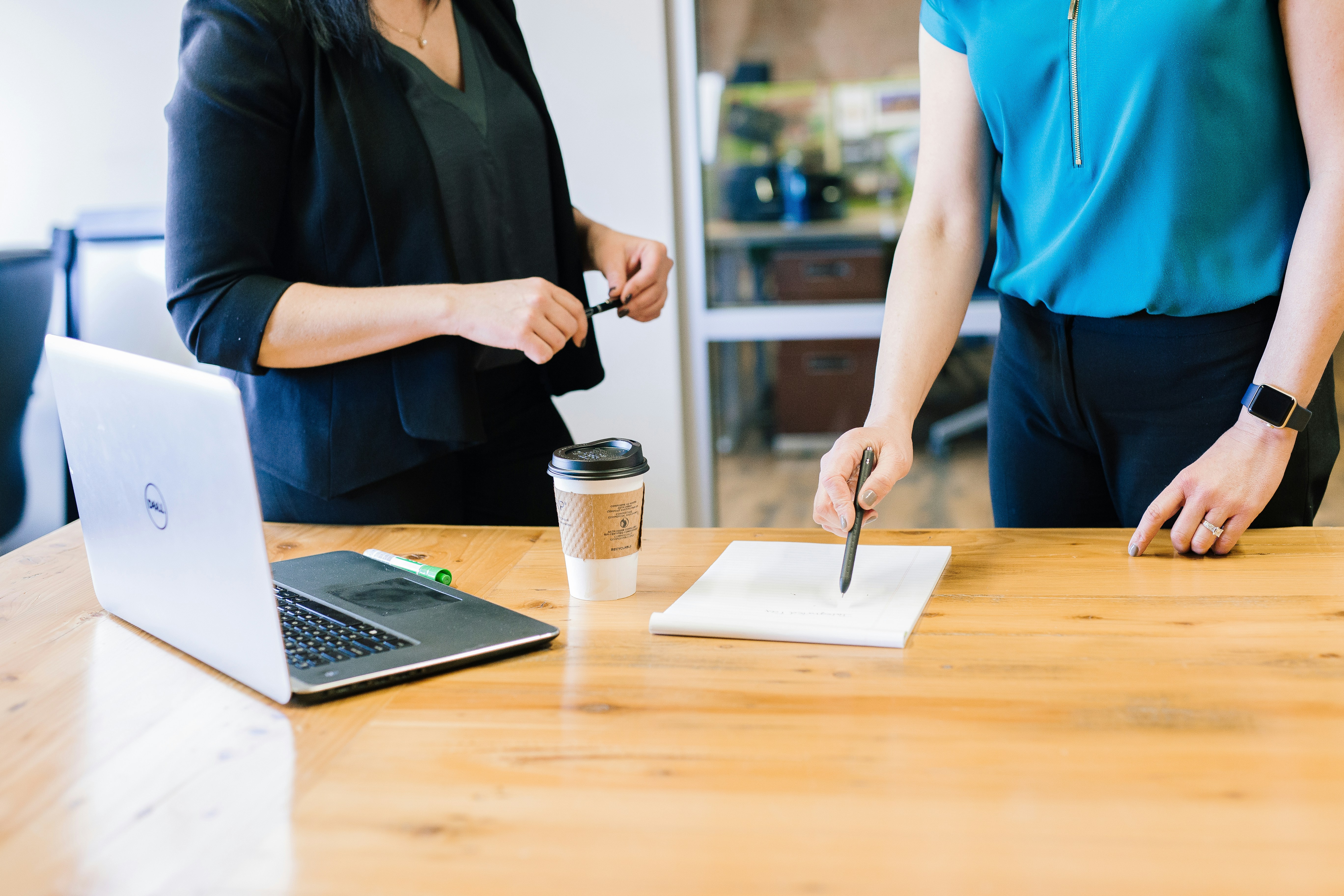 Business women pointing at paper